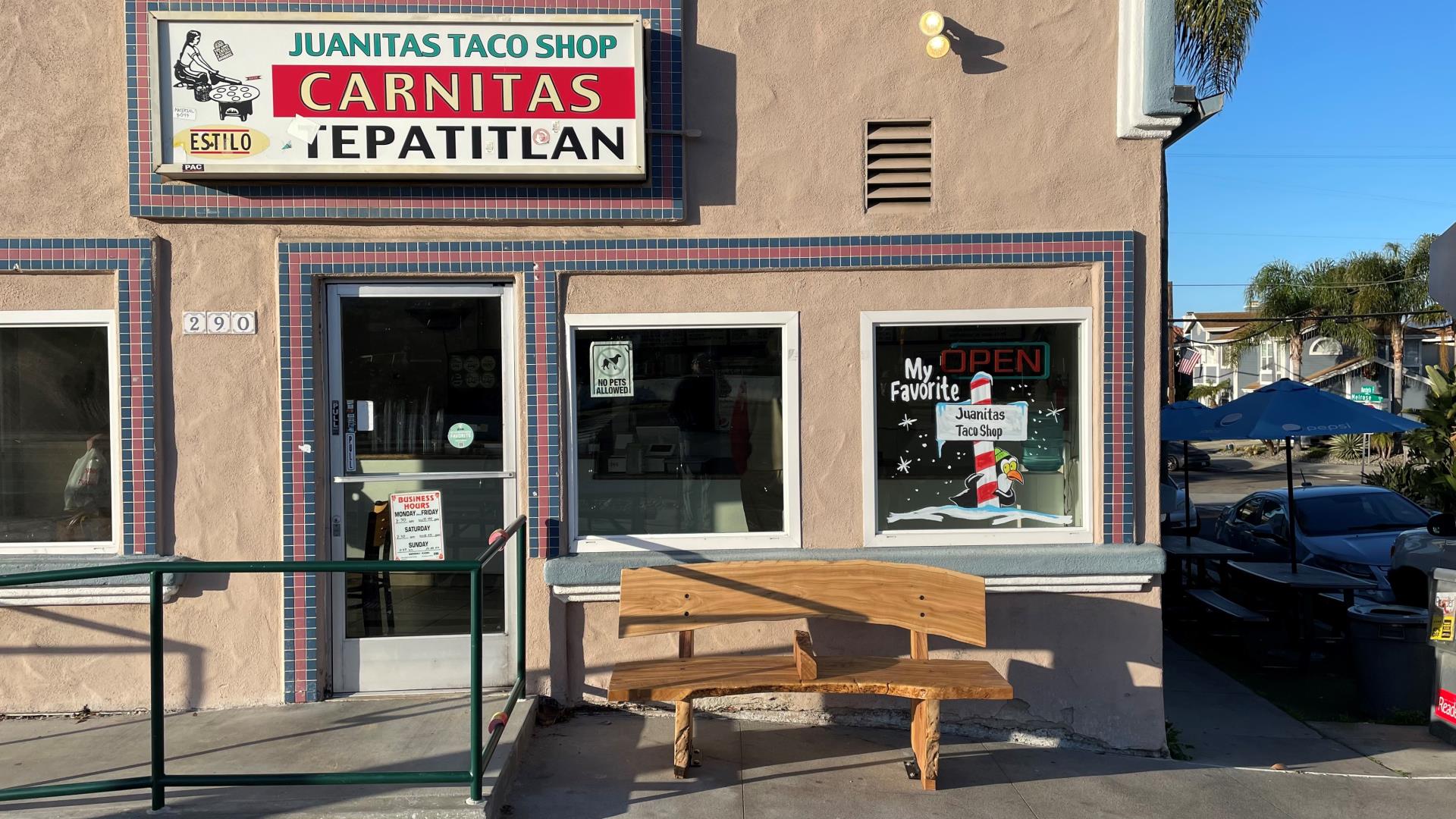 Bench in front of a restaurant