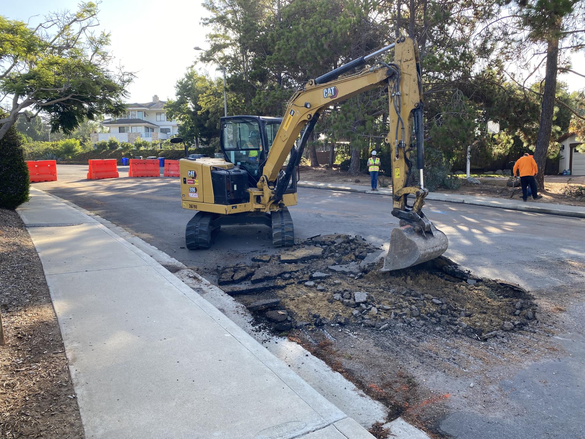 Construction Equipmient starting removal of along Crest Drive at Via Tiempo