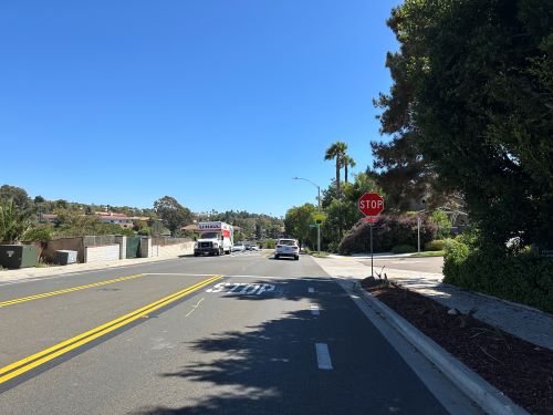 Photo of new stop sign and improvements at Quail Gardens Drive and Kristen Ct.